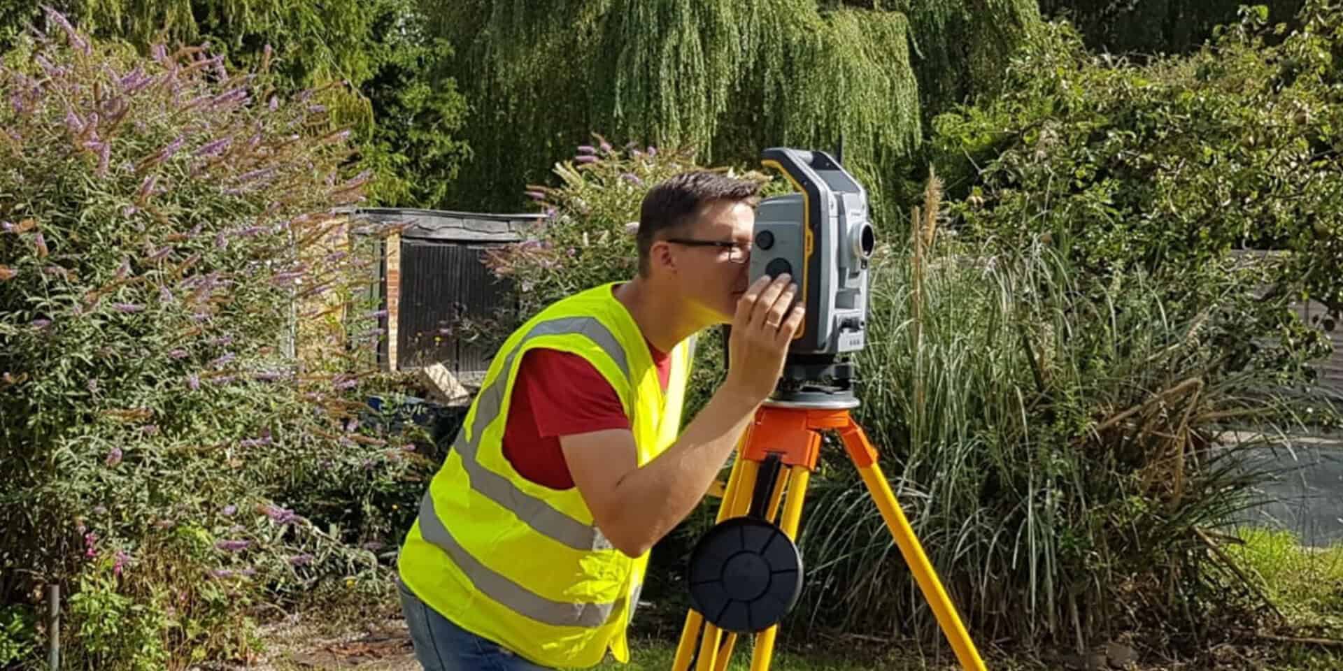 Surveyor conducting a topographical survey